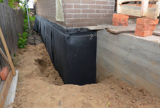 SJ Waterproofing Pros technician performing targeted Exterior Waterproofing assessment in Albany, NY